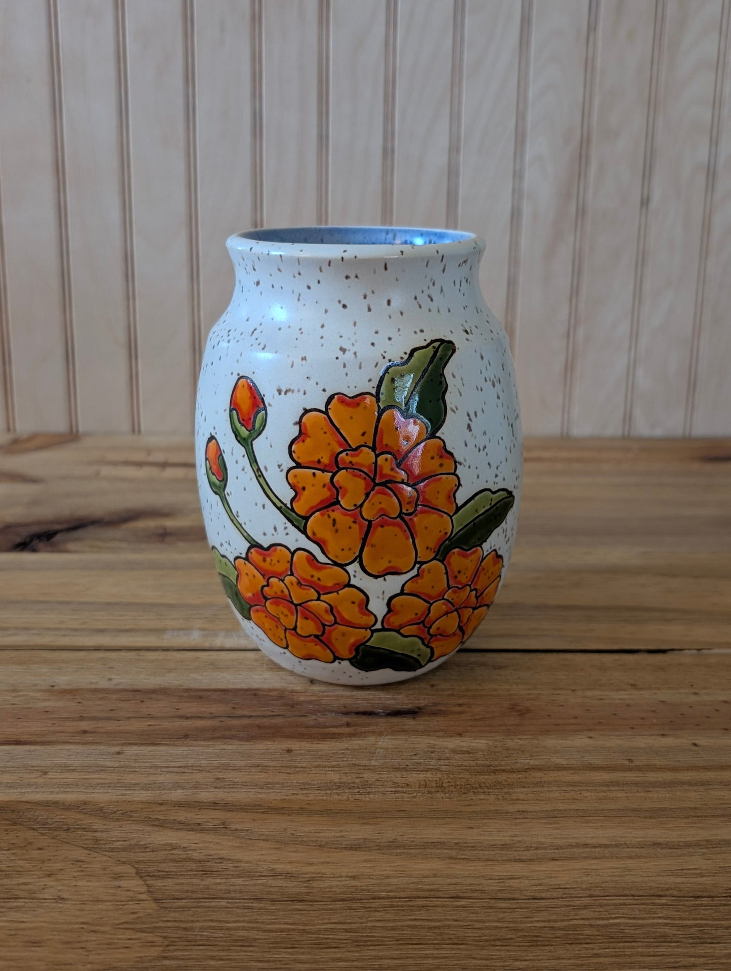 orange flower vase