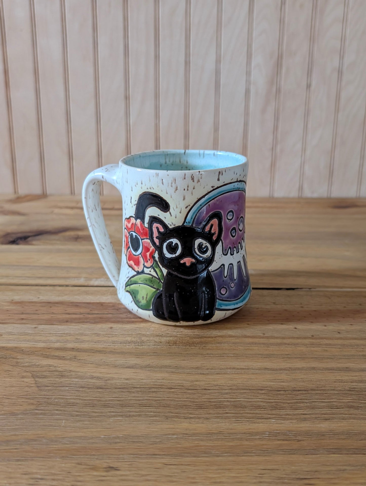 cat and fishbone potion bottle