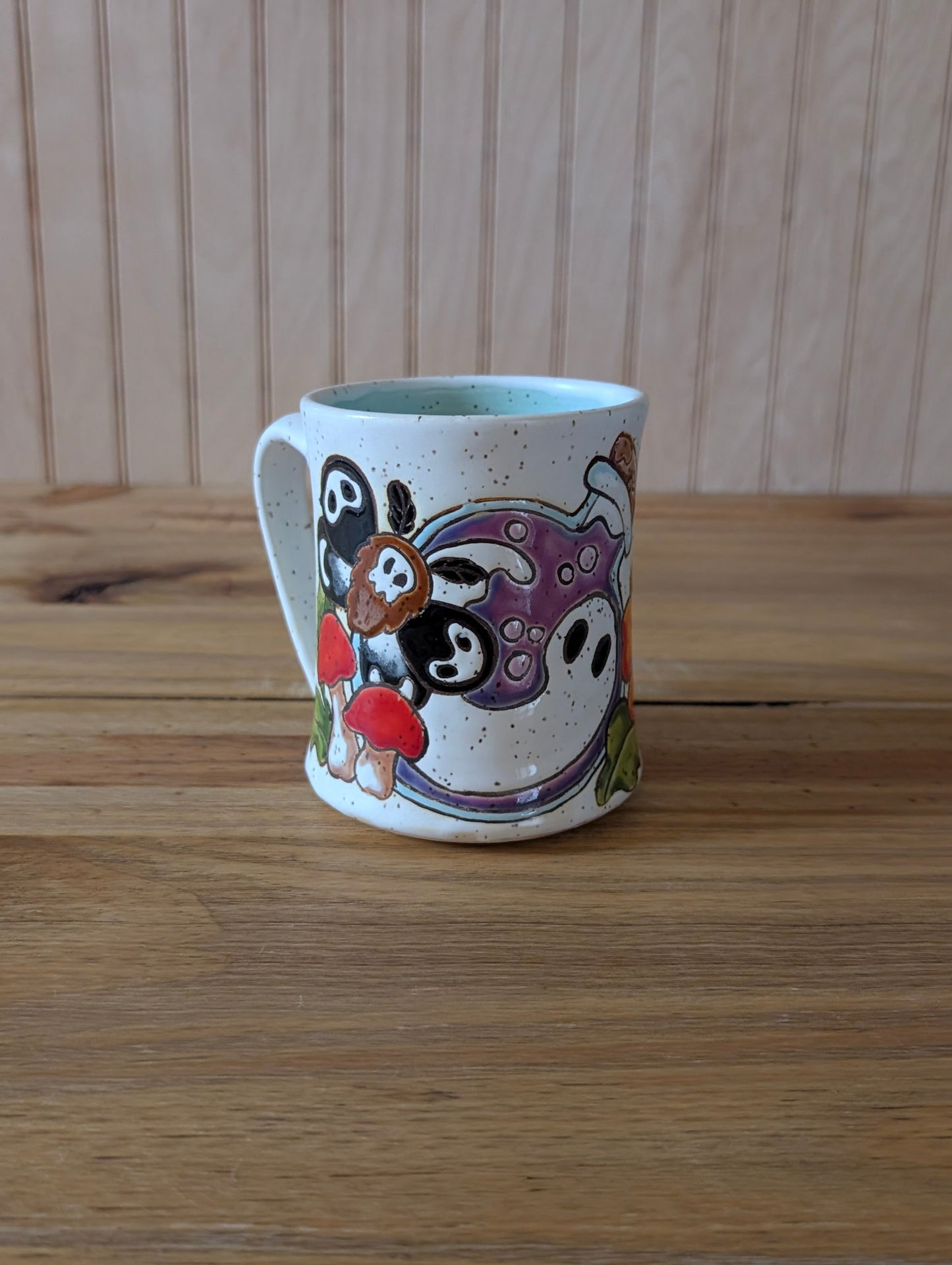 potion bottle with ghost and death's head hawk-moth