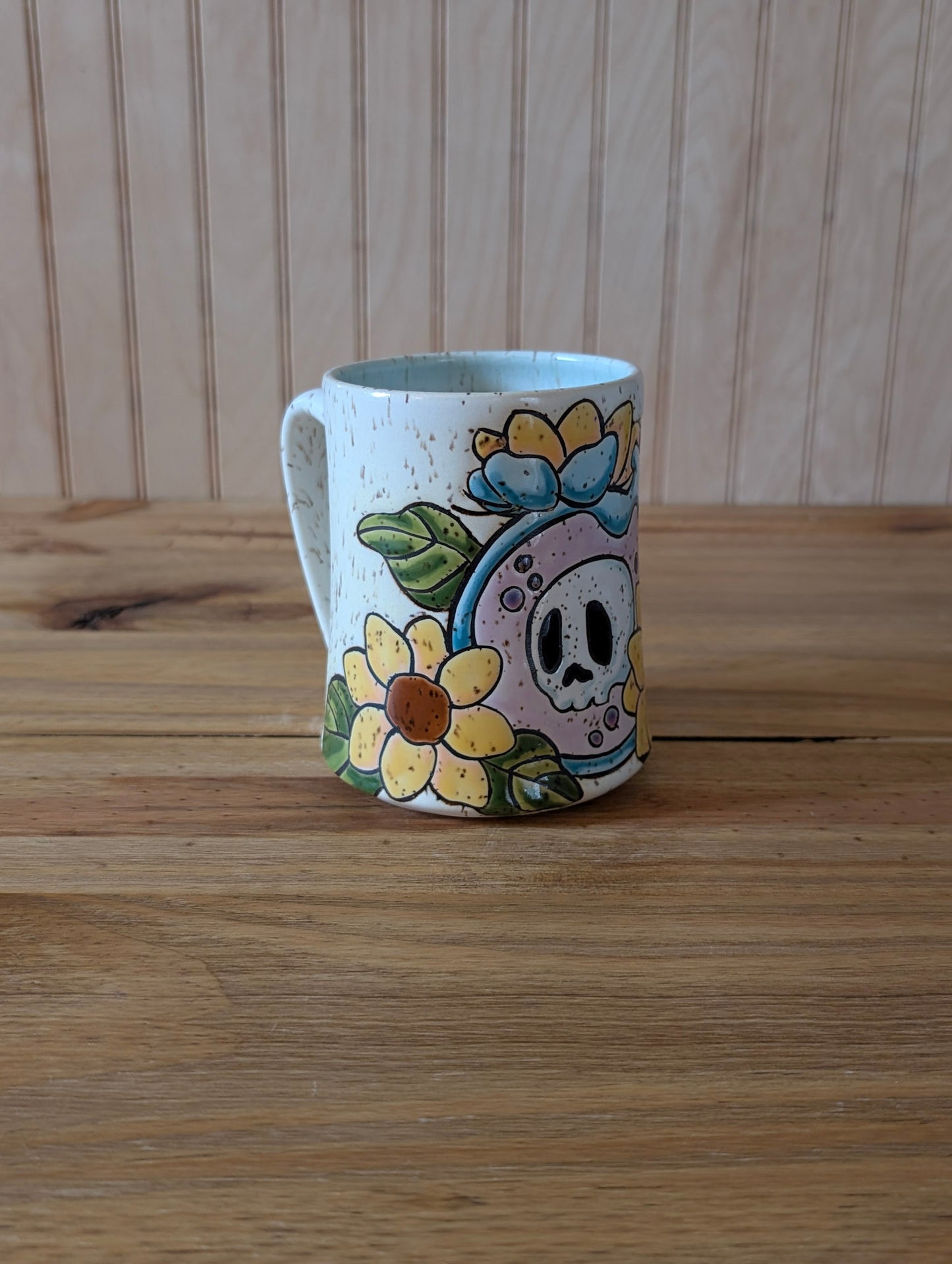 potion bottle with trapped skull and sunflowers