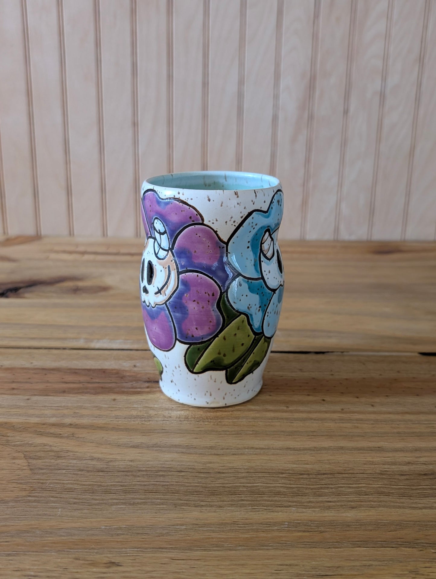 skull and horned skull flower cup
