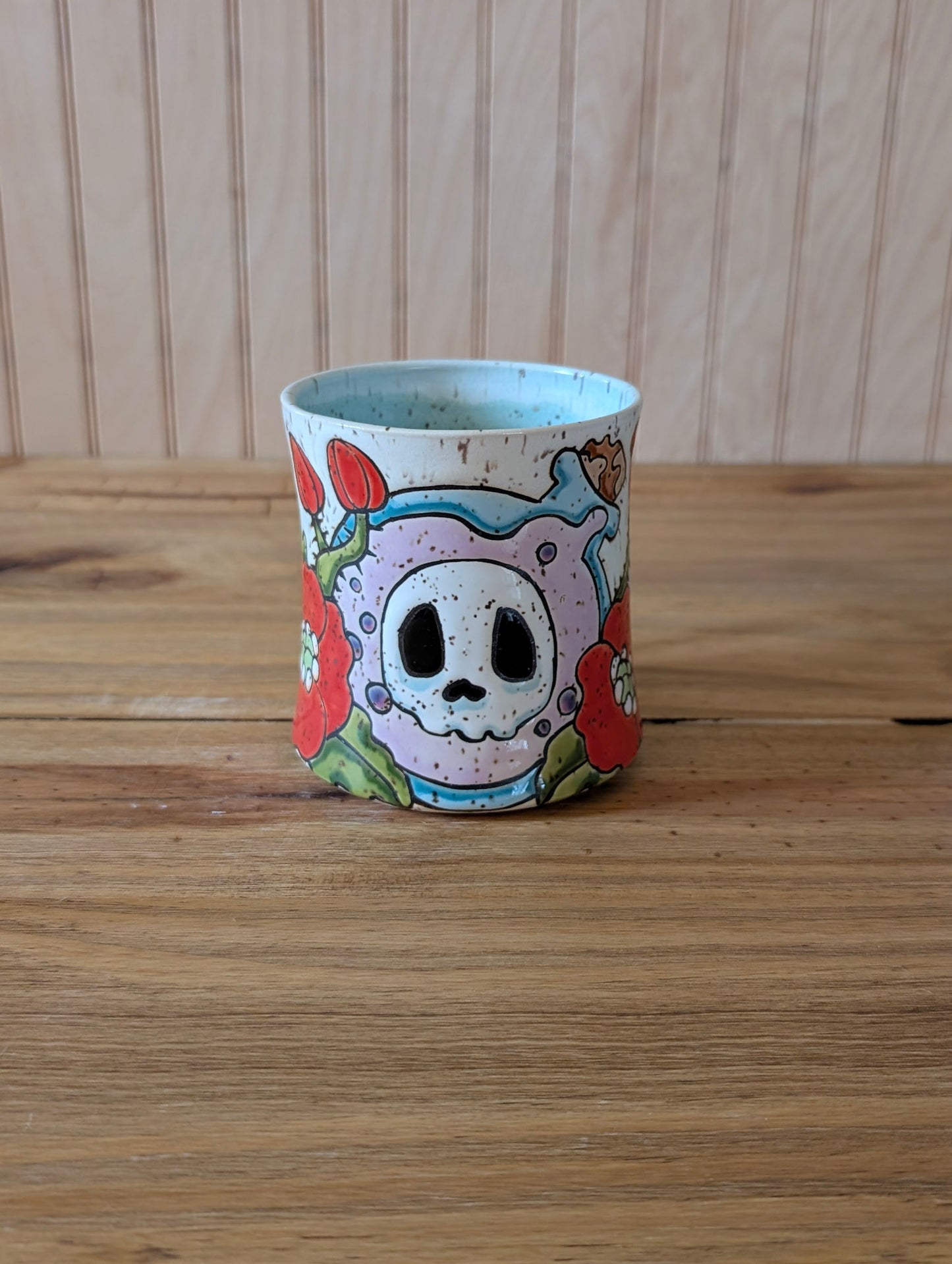 potion bottle with skull and poppies mug