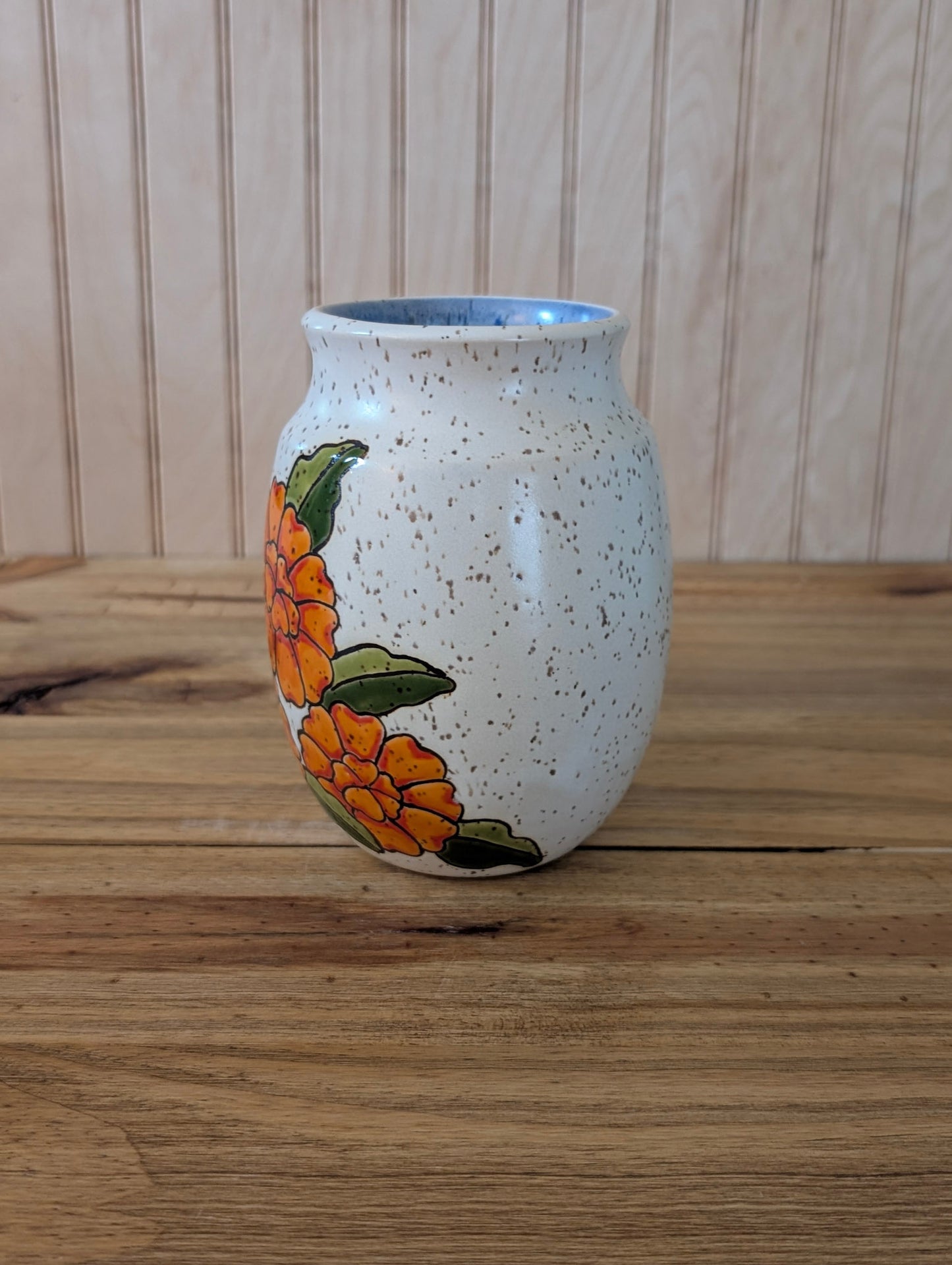 orange flower vase