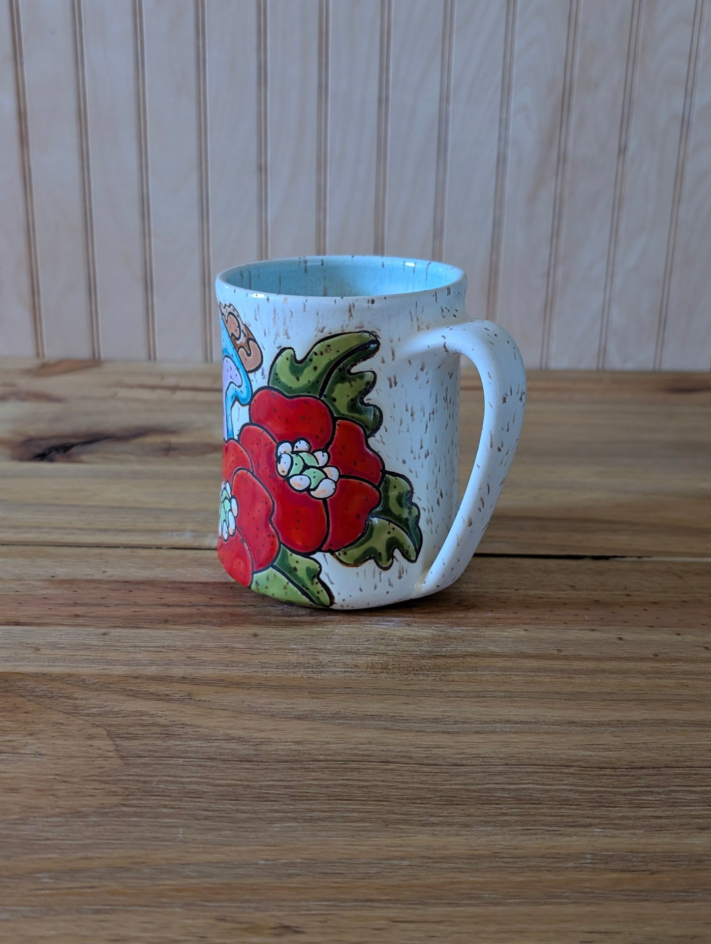 Potion bottle with skull and poppies mug two