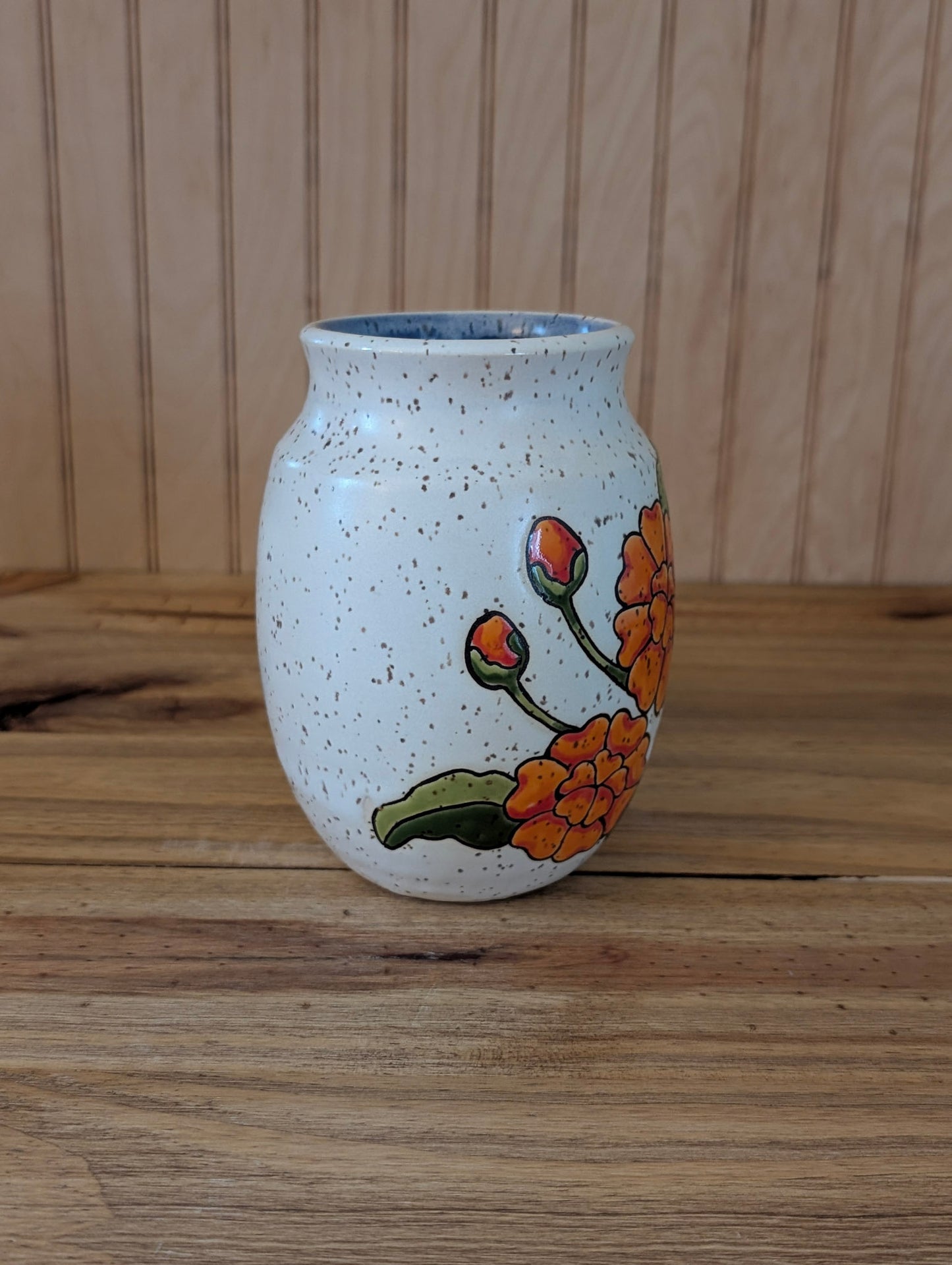 orange flower vase