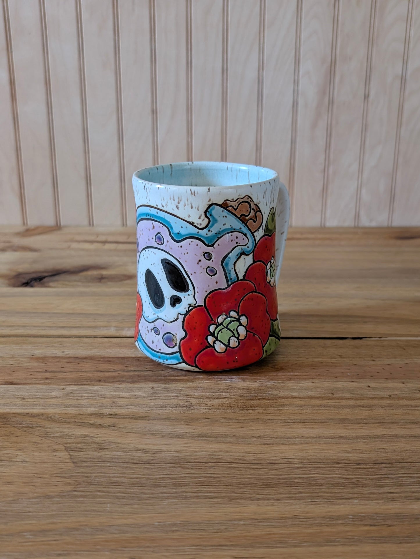 Potion bottle with skull and poppies mug two